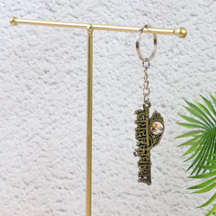 Close-up of Jai Dwarkadhish text on metal keychain