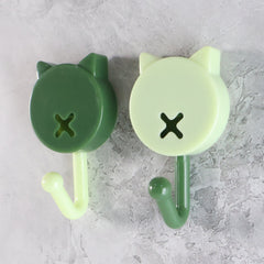 Beige round stick-on hooks close-up