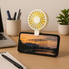 Mini handheld fan showing foldable handle