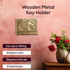 Front view of wooden key holder with four gold hooks
