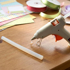Hot glue stick inserted into a glue gun