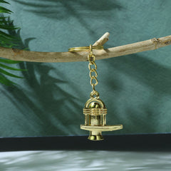 Golden Shivling metal keychain with intricate details