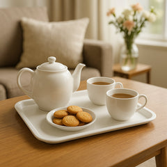 Close-up of the raised rim and smooth surface of the white plastic tray.