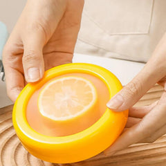Angled view of yellow produce keeper with lid on