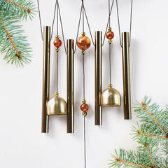 Wind chimes with Ganesh design in garden setting
