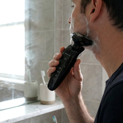Electric rotary shaver for wet and dry use