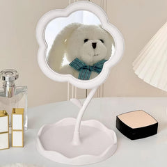 Woman's hand adjusting the rotatable flower makeup mirror
