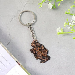 Close-up of Radha Krishna metal keychain detail