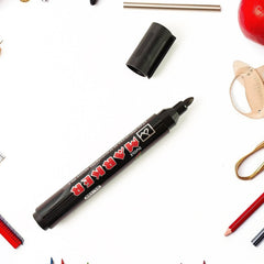Black ink whiteboard marker with silver body and bullet tip on white background