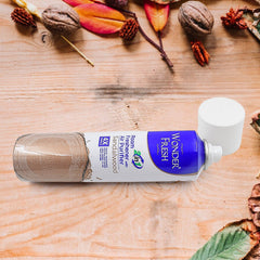 Sandalwood air freshener spray with golden wood background