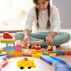 Kids playing with construction vehicle toys on a mat