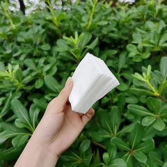 Cotton pads held in a hand showing softness
