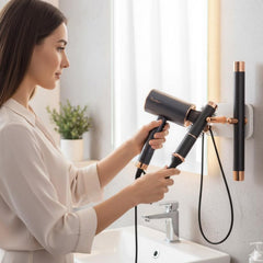 Close up of hair dryer holder on bathroom wall