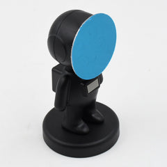 Astronaut phone holder attached securely with adhesive pad