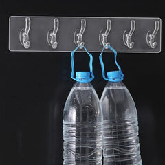Heavy duty 6-pin transparent and golden wall hook rail installed on wall