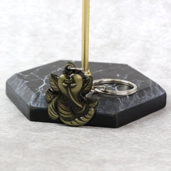 Ganesh Face antique black metal keychain, side view