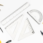 Clear plastic 4-piece geometry tool set including triangle ruler and protractor