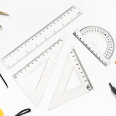 Clear plastic 4-piece geometry tool set including triangle ruler and protractor