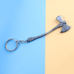 Close-up view of the stylish metal axe keychain accessory