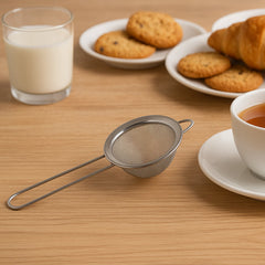 Efficient kitchen tool for food preparation and straining