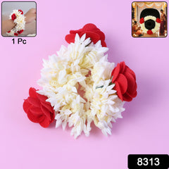 Red and white artificial flower gajra worn as hair accessory