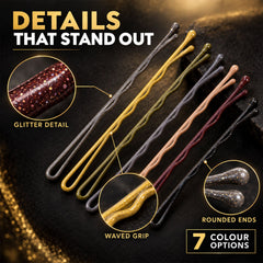 Seven glittery hairpins in various colors are arranged on a dark surface, highlighting their waved grip and rounded tips.