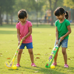 Kids holding plastic cricket bat and hockey stick