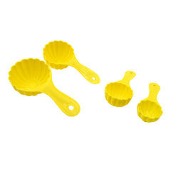 Four different plastic ladoo moulds arranged neatly