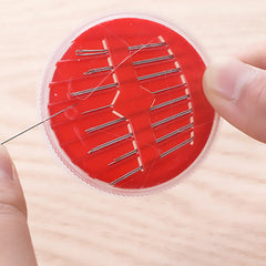 Sewing scissors and needle threader included in kit