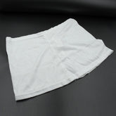 Women's high-waisted athletic skort front view in white