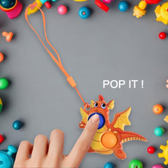 Hand pressing sensory bubbles on dragon toy