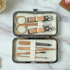 Nail grooming kit tools organized in compact storage case