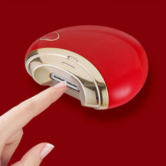 Electric nail clipper showing USB charging port & cleaning brush