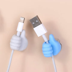 White hand clip holding charging cables