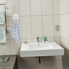 Strong suction cup hook securing towel on bathroom wall