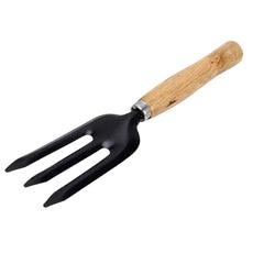 Grow Garden Tools hand weeding fork resting on soil