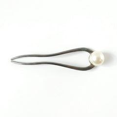 Close-up of pearl hair pin