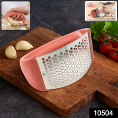 Supermom Curve Garlic Crusher showing stainless steel pressing surface