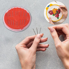 Close-up of needle threader tool in sewing kit