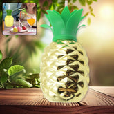 Plastic pineapple cup with straw filled with drink