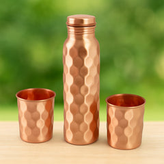 Diamond Cut Copper Bottle & Glasses Set on White Background
