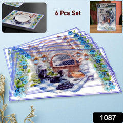 Close-up of colorful dining table placemats on a wooden table