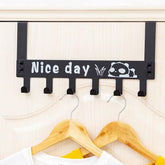 Panda over door hook rack in use, hanging towels on a white door
