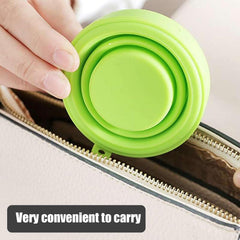 Silicone foldable travel mug showing flexible material