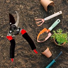Close-up of red garden secateur cutter