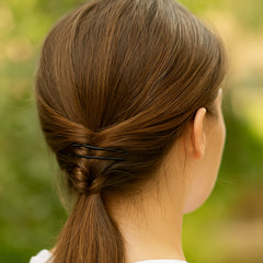 Mini black bobby pins in a pile