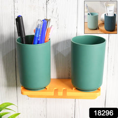 Close-up of wall mounted toothbrush & cup organizer
