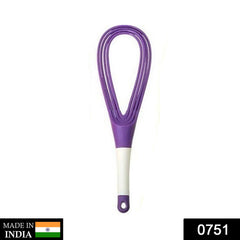Plastic whisk mixer blending milk and coffee