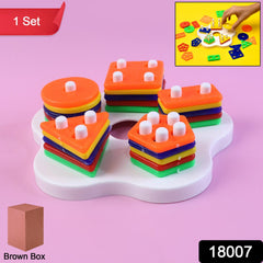 Toddlers playing with geometric sorting stacking toy