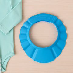 Soft flexible baby shower cap protecting eyes and ears